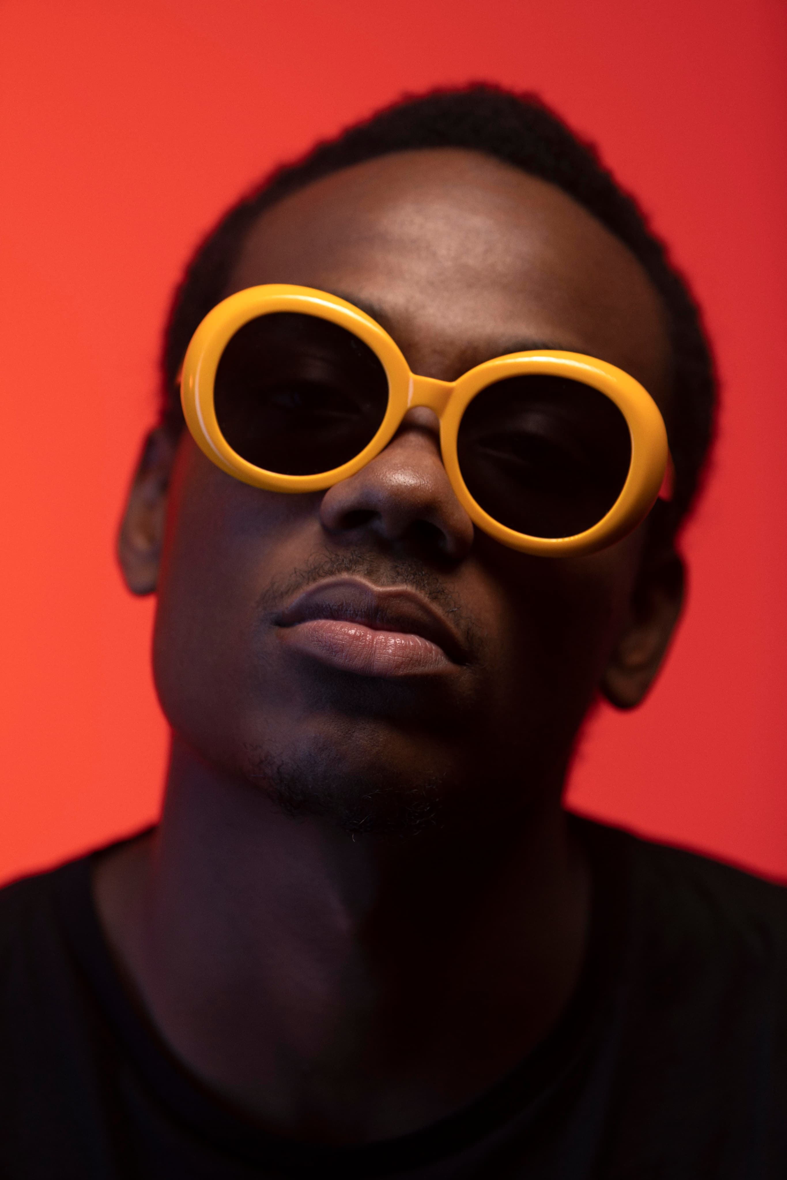 Creative wearing round orange sunglasses
